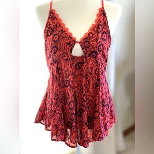 New Free People Halter Top. Flowing fabric with ribbon straps in orange. Size L